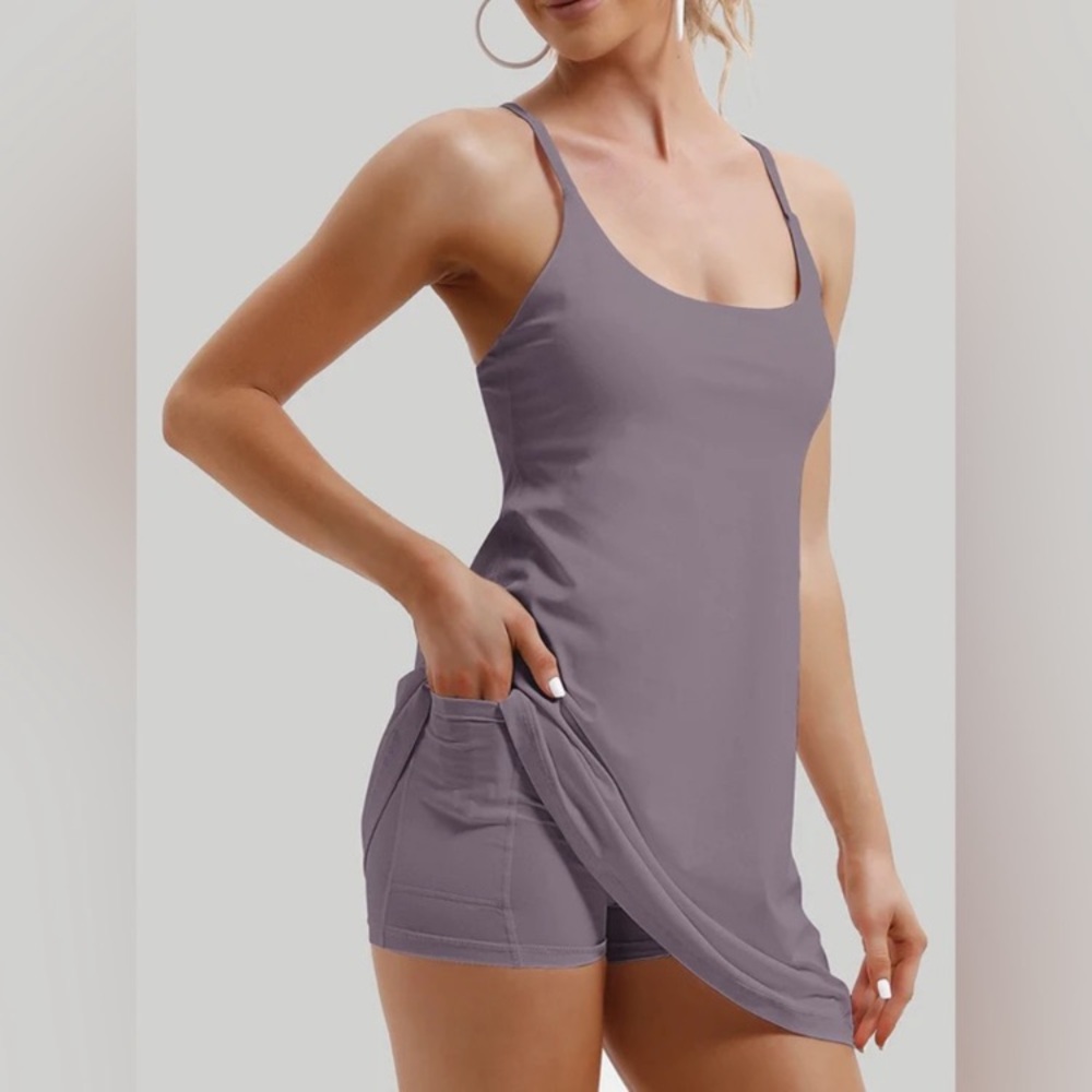 Barely worn. Purple tennis Dress with built in shorts with two side pockets